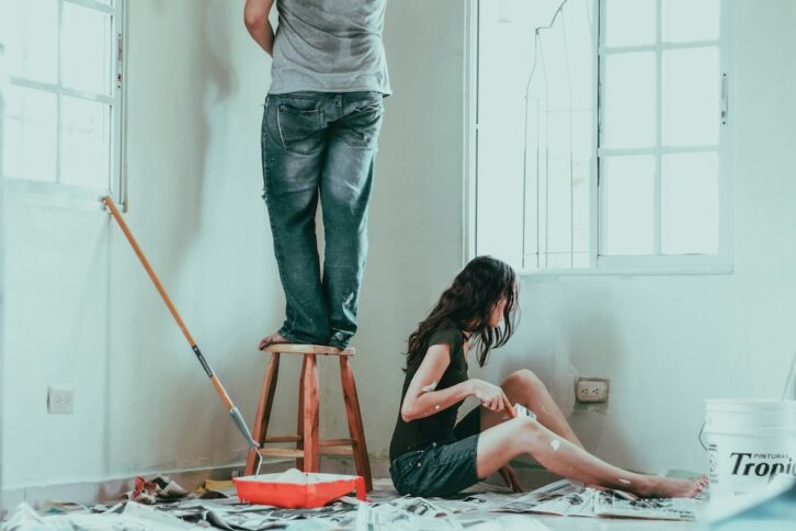 couple painting their home white